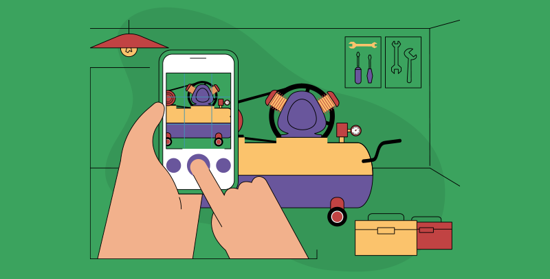 Registro da manutenção de compressor de ar sendo feito por celular, com enquadramento do equipamento e interface de captura na tela.