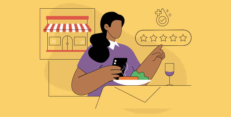 Cliente segurando um celular avaliando a limpeza do ambiente em um restaurante.